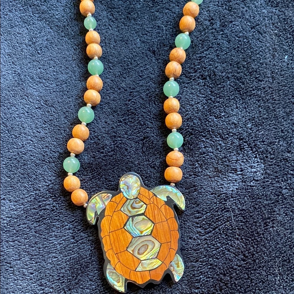 Lee Sands Turtle Pendant Necklace-made of shells, woods, and precious stones.